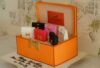 A Hermes-themed cake featuring miniature handbag decorations in vibrant colors, perfect for luxury fashion enthusiasts.