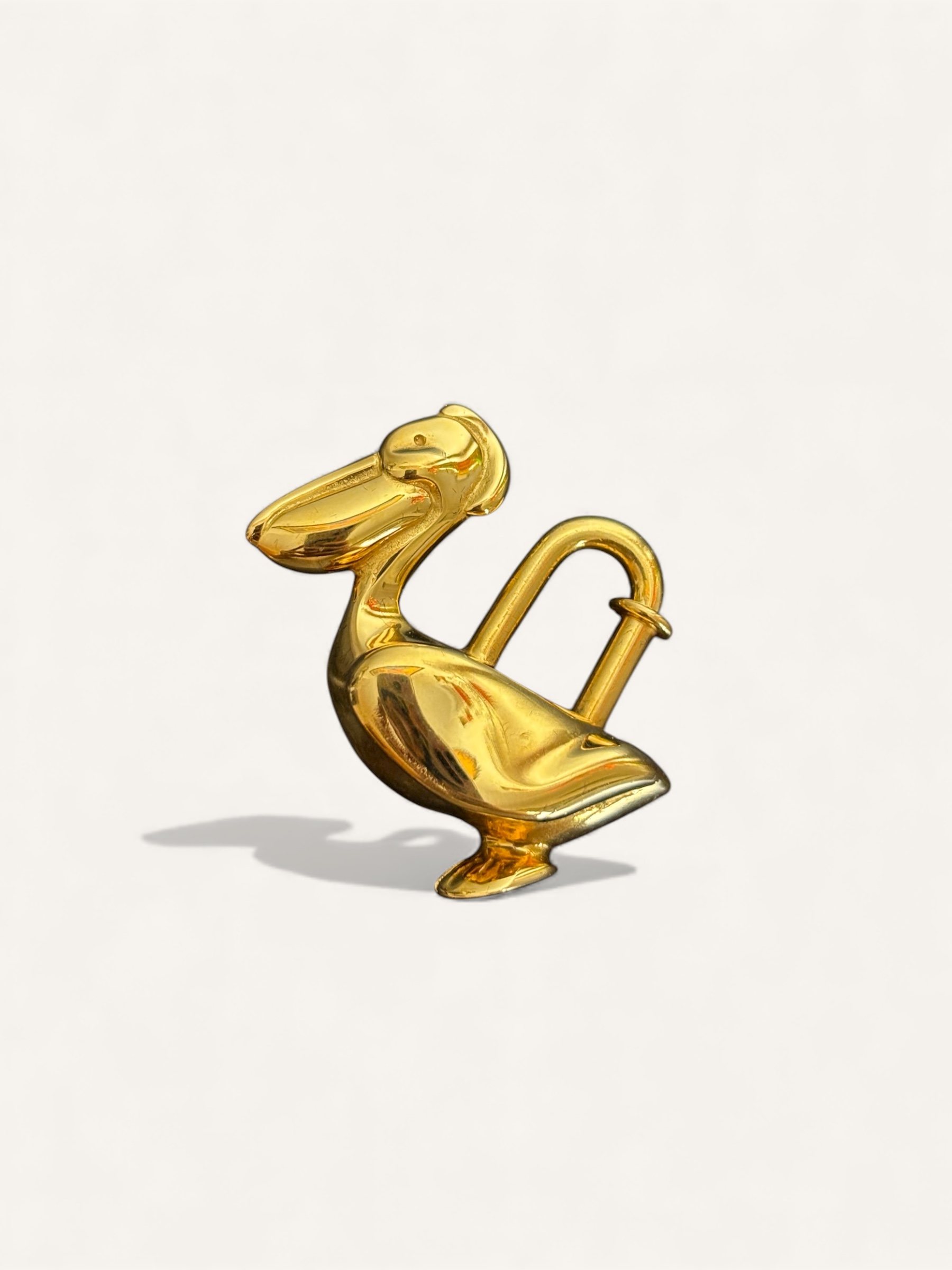 bijou de sac Hermès cadenas pélican doré