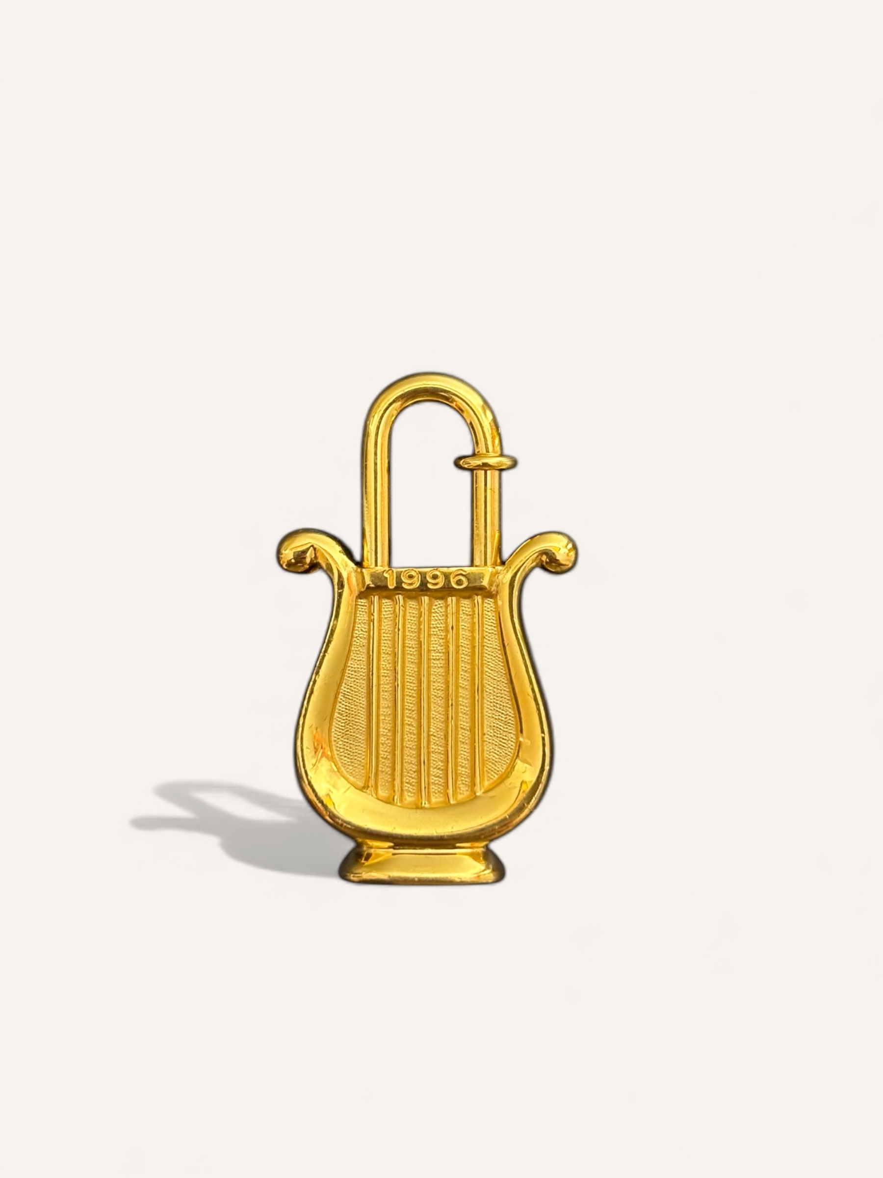 cadenas Hermès doré 1996 année de la musique
